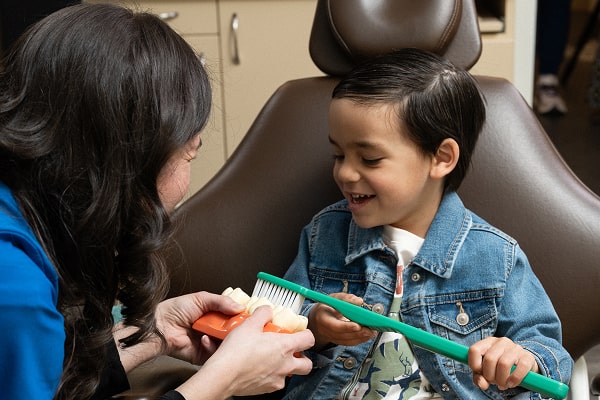 A boy is happily smiling in a dental chair with South Jersey dentist