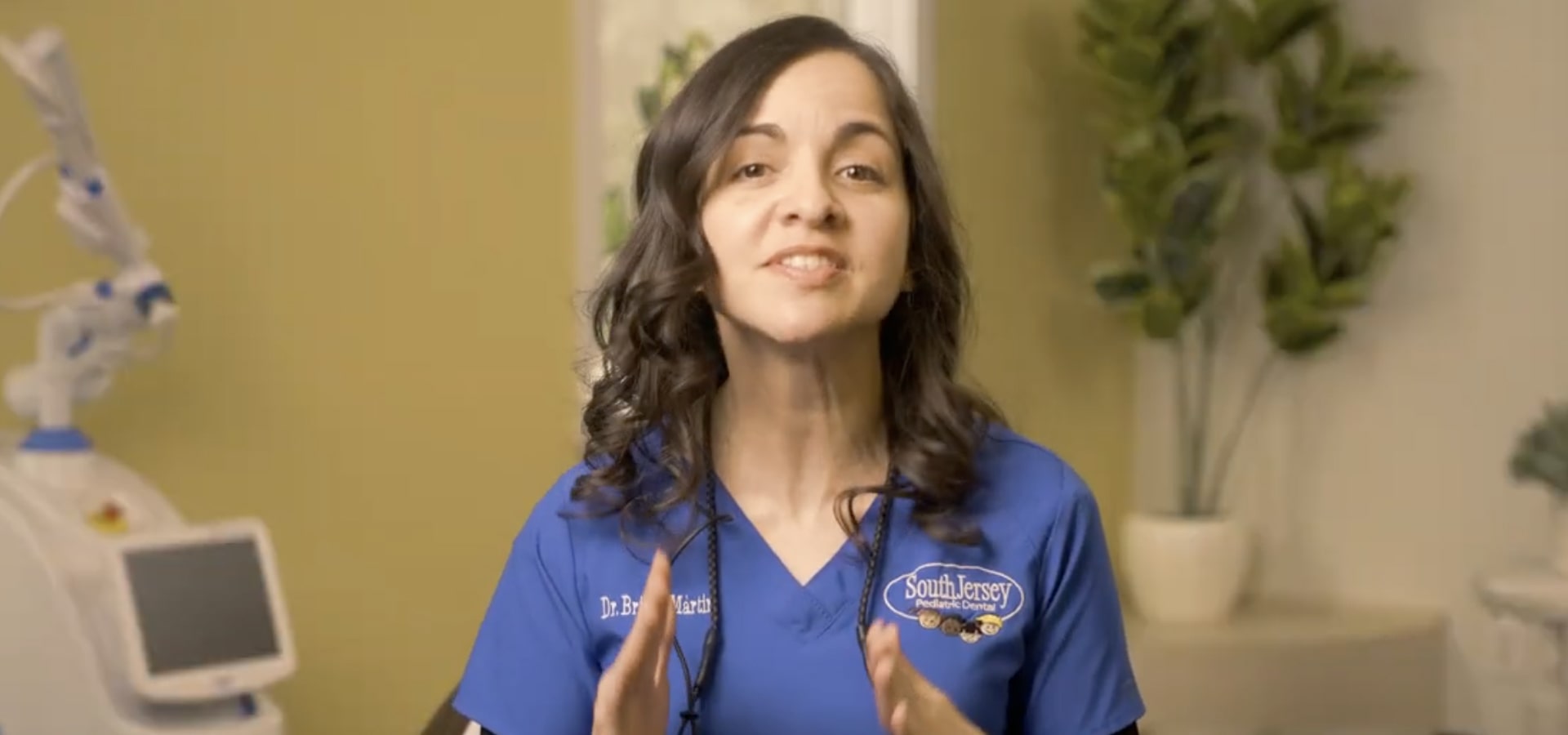 Dentist is welcomely smiling