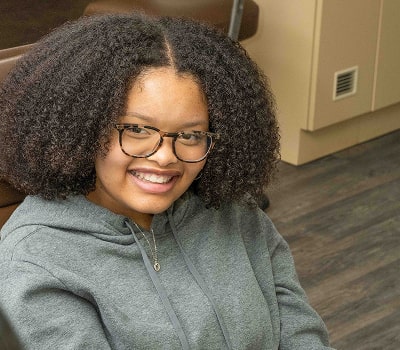 A girl enjoying dental visit and smiling