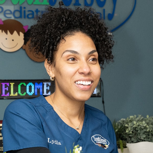 A woman is happily smiling