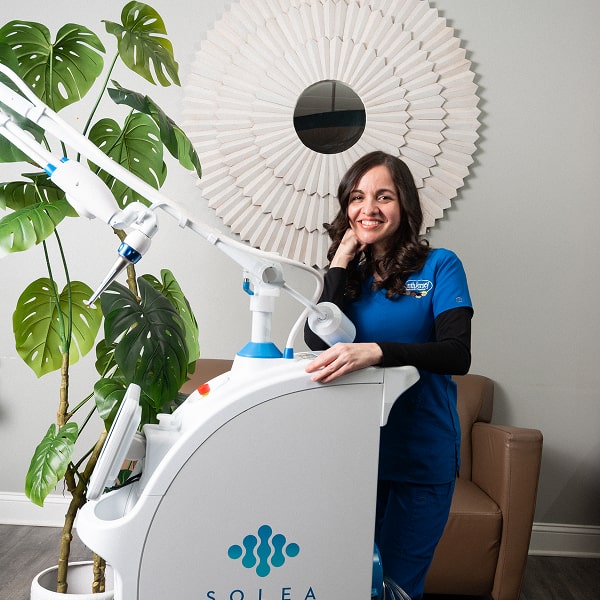 Dentist is welcomely smiling