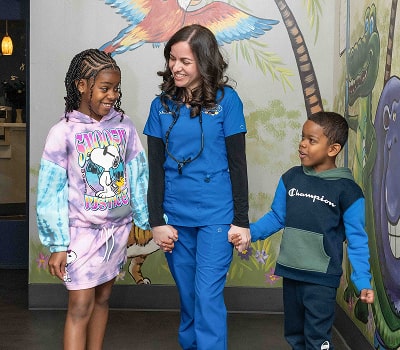 Dentist with two kids are smiling at South Jersey