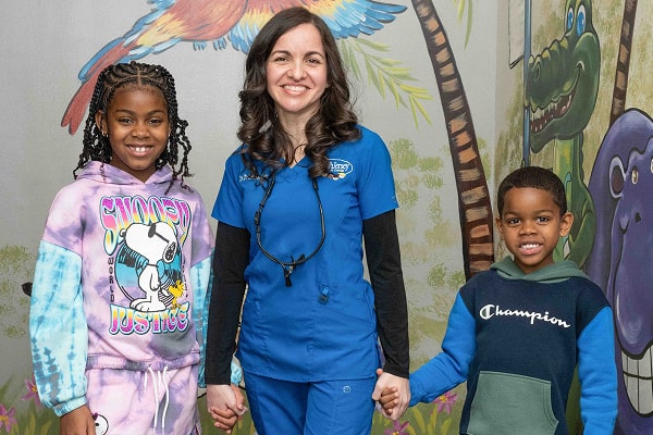 Dr. Brendaliz is smiling with her patients