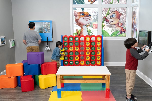 Kids are playing in a special room at South Jersey Dental