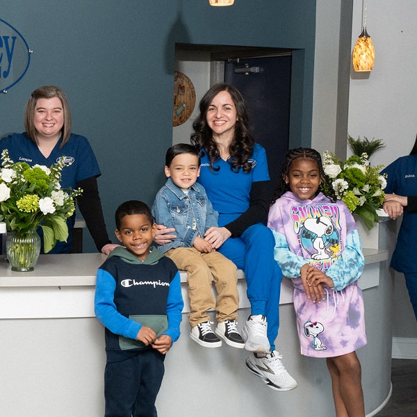 South Jersey pediatric dentist is smiling with her patients