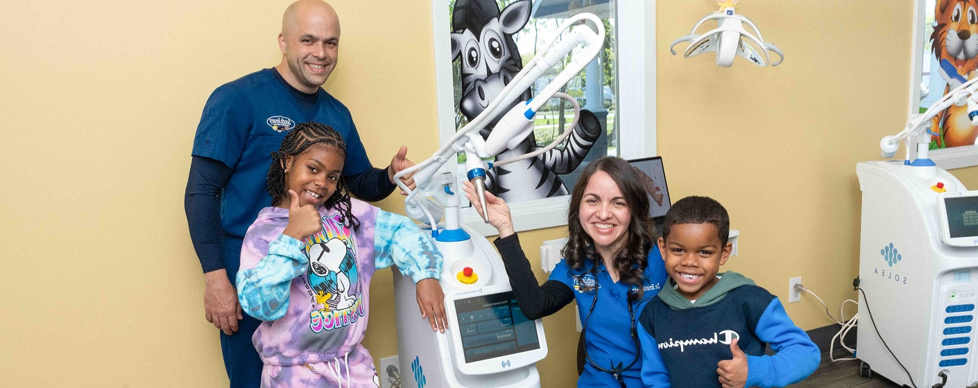 South Jersey team with their young smiling patients
